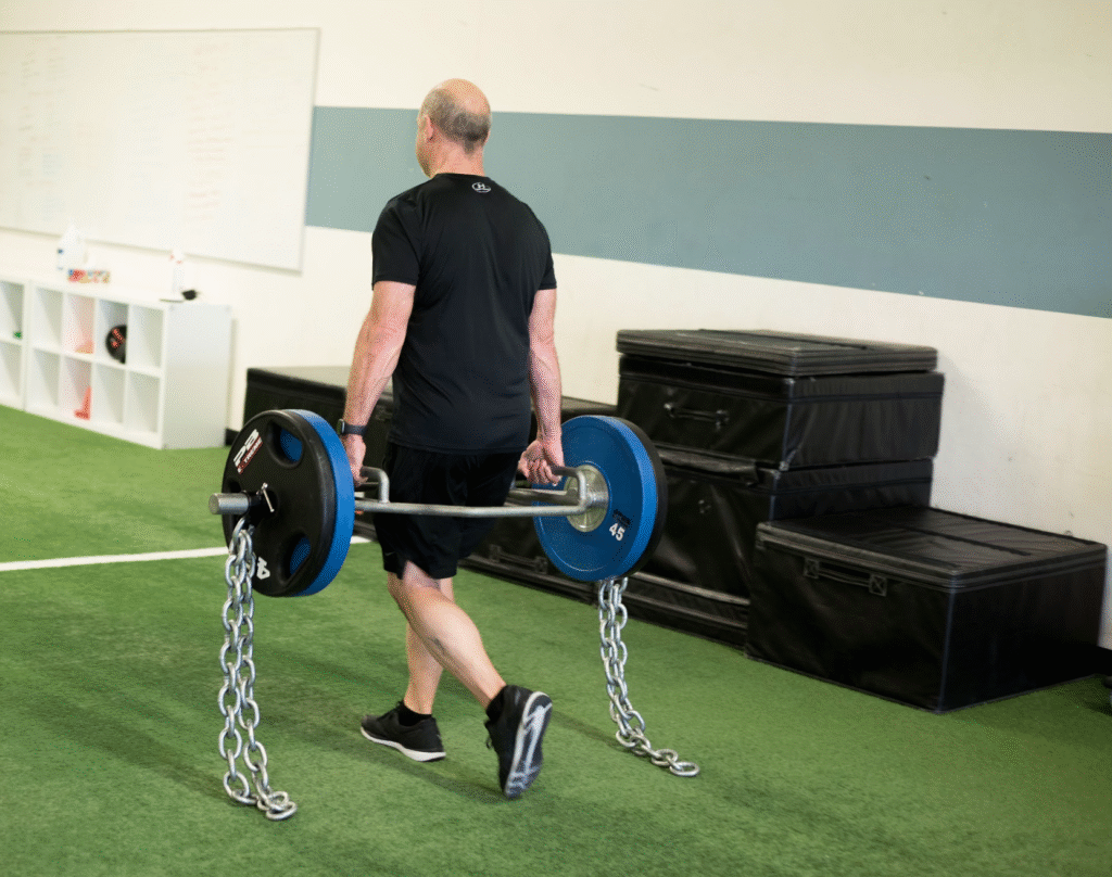 Farmer Carry for adult grip, hip, and total body strength and conditioning